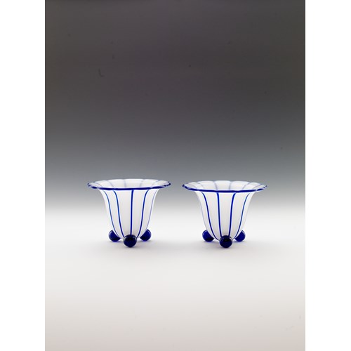 A PAIR OF VASES ON BALL FEET